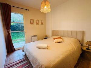 a bedroom with a bed with two pillows on it at Le Vercors Park in Die