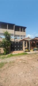 a large brick building with a large building at Bissau Residence in Bissau