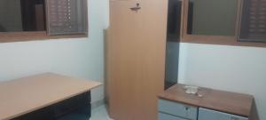 a kitchen with a table and a counter top at Bissau Residence in Bissau