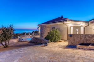 a villa with a view of the ocean at Villa Lareva - sunset view in Ustrine