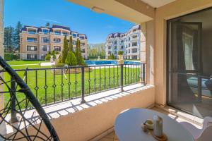 a balcony with a table and a view of a building at Les Faberges in Carpe Vita in Varna City