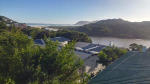 a view of a river from a building with trees at Sand Castle in Sedgefield