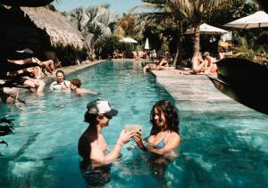 a man and woman in the swimming pool at a resort at Cocorí Lodge Paredón in El Paredón Buena Vista +117 photos