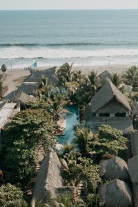 an aerial view of a resort with a beach at Cocorí Lodge Paredón in El Paredón Buena Vista