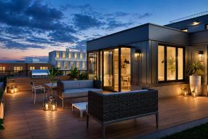 a rooftop deck of a house with a couch at Hala DC in Washington, D.C.