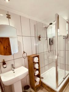 a bathroom with a sink and a shower at Brylach Steading in Aberlour +30 photos