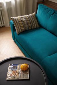 a table with a pumpkin sitting on top of a couch at Karma Rooms in Ternopil