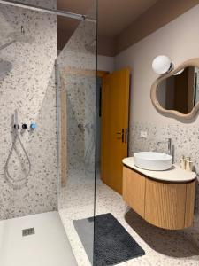 a bathroom with a sink and a shower at Perla del Mare in Cesenatico +25 photos