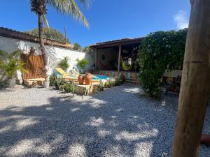 a backyard with a swimming pool and a house at CASA DA PIPA in Pipa