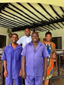 a group of men posing for a picture at Villa Kapungu with private C h e f, XXL pool & garden in Diani Beach +40 photos