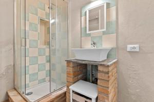 a bathroom with a sink and a shower at La Locanda Del Molino in Fortunago +44 photos