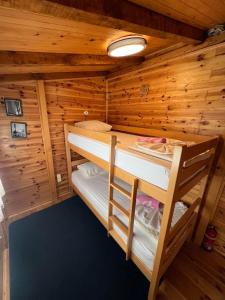 a cabin with two bunk beds in it at Dori Cottage in Ada