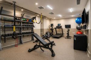 a room with a gym with exercise equipment at Hala DC in Washington, D.C.