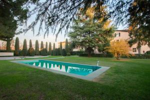 a swimming pool in the yard of a house at Vlt 901 in Brescia