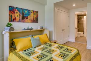 a bedroom with a bed and a painting on the wall at Walk to MIT & T Stop! Kendall Square Extended Base in Cambridge +20 photos