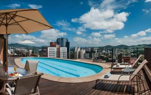 a swimming pool on the roof of a building at 807 - Hotel & Residence Sol Alphaville Flat in Barueri