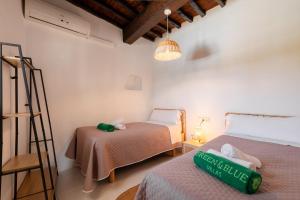 a room with two beds and a ladder at New! Villa Plana Menut in Santa Gertrudis de Fruitera +37 photos