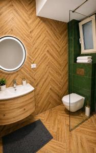 a bathroom with a sink and a mirror at Arena Park in Bucharest +54 photos