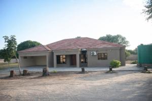 a small house with a roof at Maun Fortress in Maun Airport