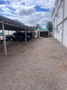 a parking lot with cars parked in a garage at Aparth ijui hotel in Ijuí