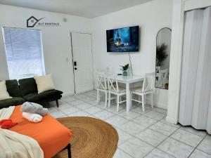 a living room with a couch and a table at Modern studio in a prime location 112-1 in Hollywood
