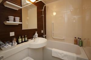 a bathroom with a sink and a shower and a tub at Hotel Monte Hermana Kobe Amalie in Kobe +90 photos