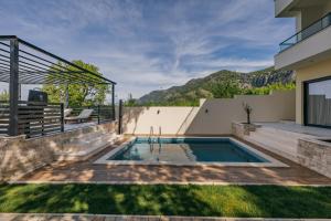 a swimming pool in the backyard of a house at Villa MIO in Bar