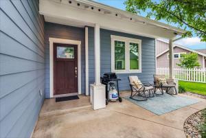 a patio with chairs and a grill on a house at Schweitzer & Dover Bay - Ski Lake Dine in Dover