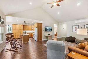 a large living room with a couch and a table at Schweitzer & Dover Bay - Ski Lake Dine in Dover