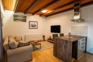 a living room with a couch and a table at UrbanApartment5 in Čakovec