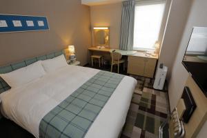 Postel nebo postele na pokoji v ubytování Hotel Monte Hermana Kobe Amalie