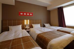 Postel nebo postele na pokoji v ubytování Hotel Monte Hermana Kobe Amalie