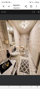 a bathroom with a sink and a toilet in it at Apartment Andras in Murau