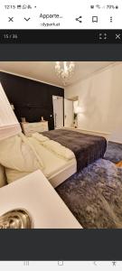 a hotel room with two beds and a sink at Apartment Andras in Murau