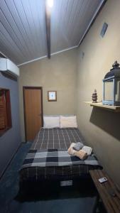 a bedroom with a bed in a room at Chalé Orion in Lençóis +27 photos