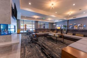 a large living room with couches and a table at Silver Cloud Hotel - Seattle Broadway in Seattle