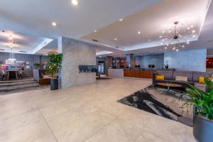 a lobby of a hotel with a bar in the background at Silver Cloud Hotel - Seattle Broadway in Seattle