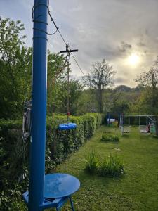 a playground in a yard with swings at Vikendica Fruškogorski kutak - Fruška Gora in Čerević
