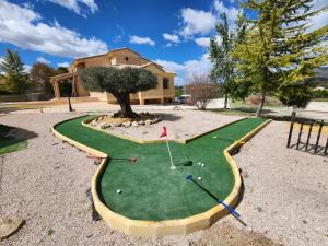 a miniature golf course in front of a house at Casa Rural Álvarez in Caravaca de la Cruz