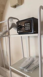 a remote control sitting on top of a shelf at Samy Suite in Fasano