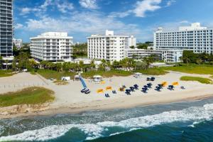 an aerial view of a beach with chairs and umbrellas at Fort Lauderdale Marriott Pompano Beach Resort in Pompano Beach