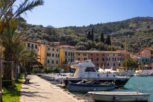 a group of boats are docked in a harbor at Ria Apartment in Le Grazie