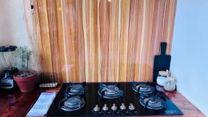 a stove top with some dishes on top of it at Villa Monarca in Ayampe +31 photos