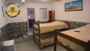 a bedroom with two bunk beds in a room at Mediterraneo Hotel in Iquique