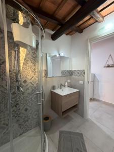 a bathroom with a sink and a shower at Marluna in Custonaci +30 photos