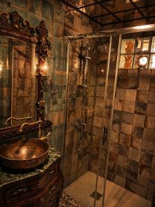 a bathroom with a sink and a shower at Luxury art Apartamenty in Pineda de Mar +16 photos