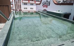 a pool of water on the roof of a building at Loft Hotel Malecón Vallarta in Puerto Vallarta