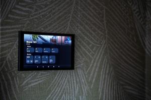 a remote control hanging on a wall at Room4 in Maurik