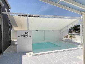 a swimming pool in the middle of a building at VILLA TSUKUNAMI aoshima in Miyazaki