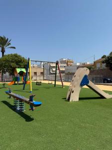 a playground with several different types of play equipment at Antique villa in Guardamar del Segura